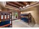 Bunk beds in a well-lit bedroom with access to a private patio at 16117 E Shooting Star Trl, Fountain Hills, AZ 85268