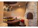 Cozy breakfast nook with a stone fireplace and custom seating at 16117 E Shooting Star Trl, Fountain Hills, AZ 85268