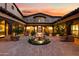 Elegant courtyard entry with fountain and lush landscaping at 16117 E Shooting Star Trl, Fountain Hills, AZ 85268