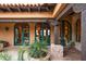 Beautiful arched windows and doors with a rustic stone exterior at 16117 E Shooting Star Trl, Fountain Hills, AZ 85268