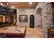 Game room features a pool table and stone accent wall at 16117 E Shooting Star Trl, Fountain Hills, AZ 85268