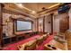 Dedicated home theater with leather seating and large screen at 16117 E Shooting Star Trl, Fountain Hills, AZ 85268