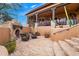 Stone patio with a fireplace and seating area at 16117 E Shooting Star Trl, Fountain Hills, AZ 85268