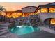 Private pool and waterfall feature in a luxurious backyard oasis at 16117 E Shooting Star Trl, Fountain Hills, AZ 85268