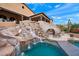 Luxury pool and waterfall feature, creating a private oasis at 16117 E Shooting Star Trl, Fountain Hills, AZ 85268