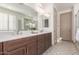 Elegant bathroom with double vanity, soaking tub and shower at 16884 W Pinchot Ave, Goodyear, AZ 85395