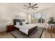 Bright bedroom with ceiling fan and wood floors at 16884 W Pinchot Ave, Goodyear, AZ 85395