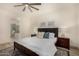 Main bedroom with wood floors, en-suite bathroom, and ceiling fan at 16884 W Pinchot Ave, Goodyear, AZ 85395