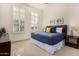 Bright bedroom with a king-size bed and plenty of natural light at 16884 W Pinchot Ave, Goodyear, AZ 85395