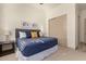 Comfortable bedroom with a king-size bed and sliding door to closet at 16884 W Pinchot Ave, Goodyear, AZ 85395