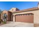 Beautiful home with a 2-car garage and well-maintained landscaping at 16884 W Pinchot Ave, Goodyear, AZ 85395