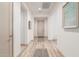 Bright hallway with light wood flooring and neutral wall colors at 16884 W Pinchot Ave, Goodyear, AZ 85395