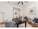 Well-lit home office, featuring a desk and comfortable seating at 16884 W Pinchot Ave, Goodyear, AZ 85395