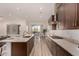 Modern kitchen with island, stainless steel appliances, and ample cabinetry at 16884 W Pinchot Ave, Goodyear, AZ 85395