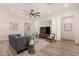 Bright and airy living room with hardwood floors, comfortable seating, and artwork at 16884 W Pinchot Ave, Goodyear, AZ 85395