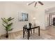 Home office features wood floors, ceiling fan, and natural light at 16884 W Pinchot Ave, Goodyear, AZ 85395