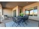 Outdoor patio features a table and chairs, ideal for entertaining at 16884 W Pinchot Ave, Goodyear, AZ 85395