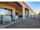 Relaxing covered patio with seating area and gravel landscaping at 16884 W Pinchot Ave, Goodyear, AZ 85395