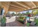 Relaxing patio area with pool, spa, and covered seating at 18026 N 136Th Way, Sun City West, AZ 85375