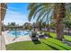 Inviting pool with patio furniture and lush landscaping at 18026 N 136Th Way, Sun City West, AZ 85375