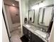 Double vanity bathroom with granite countertops and large mirrors at 18401 W Long Lake Rd, Goodyear, AZ 85338