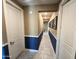 Clean hallway with tile flooring and neutral wall colors at 18401 W Long Lake Rd, Goodyear, AZ 85338