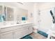Clean bathroom with double vanity and a bathtub at 18406 W Sunbelt Dr, Surprise, AZ 85374