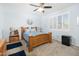 Bedroom with a wooden bed frame and window shutters at 18406 W Sunbelt Dr, Surprise, AZ 85374