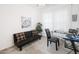 Home office features a comfortable couch and a work desk at 18406 W Sunbelt Dr, Surprise, AZ 85374