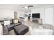 Open living room, kitchen, and breakfast bar area at 18406 W Sunbelt Dr, Surprise, AZ 85374