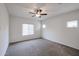 Bright bedroom with window, ceiling fan, and carpeted floor at 21166 W Monte Vista Rd, Buckeye, AZ 85396