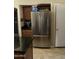 Stainless steel French door refrigerator in the kitchen at 22583 W Lasso Ln, Buckeye, AZ 85326