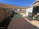 Inviting backyard pool with patio and shade cover at 22583 W Lasso Ln, Buckeye, AZ 85326