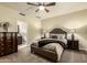 Comfortable bedroom with carpeted floors and ensuite bathroom access at 24008 S Lakeway Nw Cir, Sun Lakes, AZ 85248