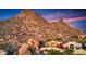 Home nestled into a rocky hillside with breathtaking sunset views at 24350 N Whispering Ridge Way # 49, Scottsdale, AZ 85255