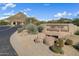 Entrance to Quail Ridge Whispering Ridge community, featuring a sign and desert landscaping at 24350 N Whispering Ridge Way # 49, Scottsdale, AZ 85255