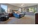 Main bedroom with king bed, ceiling fan, and large windows at 2874 E Westchester Dr, Chandler, AZ 85249