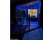 Covered patio with grill and blue lighting at night at 29864 N Desert Willow Blvd, San Tan Valley, AZ 85143