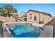 Inviting backyard pool with a waterfall feature and spacious patio at 29864 N Desert Willow Blvd, San Tan Valley, AZ 85143