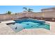 Spacious backyard pool with a stone deck and water feature at 29864 N Desert Willow Blvd, San Tan Valley, AZ 85143