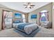 Primary bedroom with a king-size bed and plenty of natural light at 29864 N Desert Willow Blvd, San Tan Valley, AZ 85143