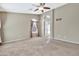 Bright bedroom featuring large window and ceiling fan at 29864 N Desert Willow Blvd, San Tan Valley, AZ 85143