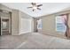 Spacious bedroom with double doors and carpet flooring at 29864 N Desert Willow Blvd, San Tan Valley, AZ 85143