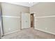 Bright bedroom with double doors and carpet flooring at 29864 N Desert Willow Blvd, San Tan Valley, AZ 85143