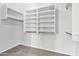 Large walk-in closet with ample shelving and hanging space at 29864 N Desert Willow Blvd, San Tan Valley, AZ 85143
