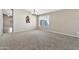 Spacious dining room with carpet, chandelier, and a window with blinds at 29864 N Desert Willow Blvd, San Tan Valley, AZ 85143