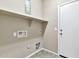 Laundry room with built-in shelving and exterior access at 29864 N Desert Willow Blvd, San Tan Valley, AZ 85143