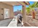 Covered patio with grill, offering pool and backyard views at 29864 N Desert Willow Blvd, San Tan Valley, AZ 85143