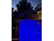 Blue-lit swimming pool and patio furniture at night at 29864 N Desert Willow Blvd, San Tan Valley, AZ 85143