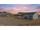 Modern farmhouse exterior with a metal roof and two-car garage at 31 W Canyon St, Apache Junction, AZ 85120